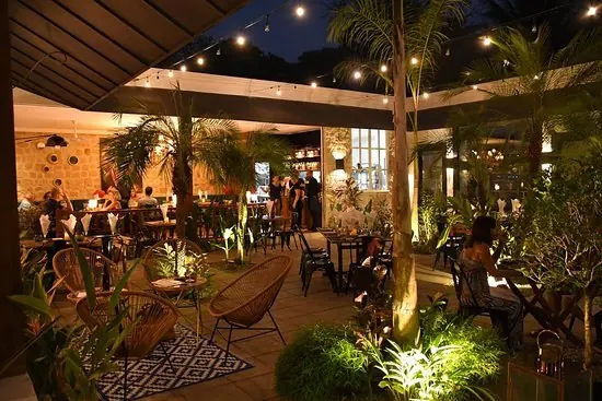 The garden dining room at Citrus, Ojochal, lit for the evening