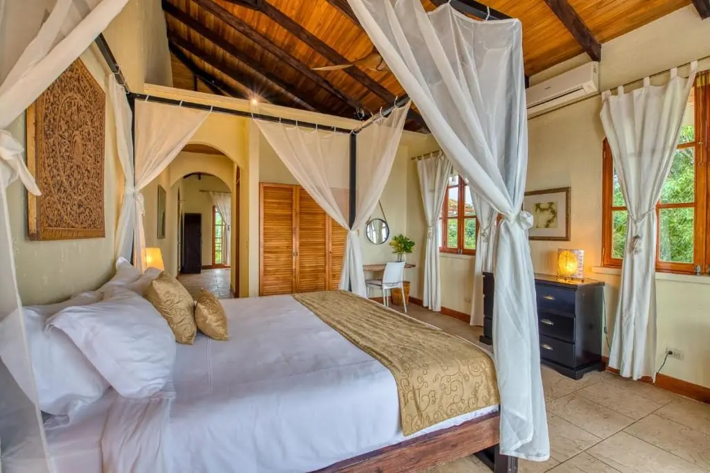 Ocean View Suite with king four-poster bed and ocean view