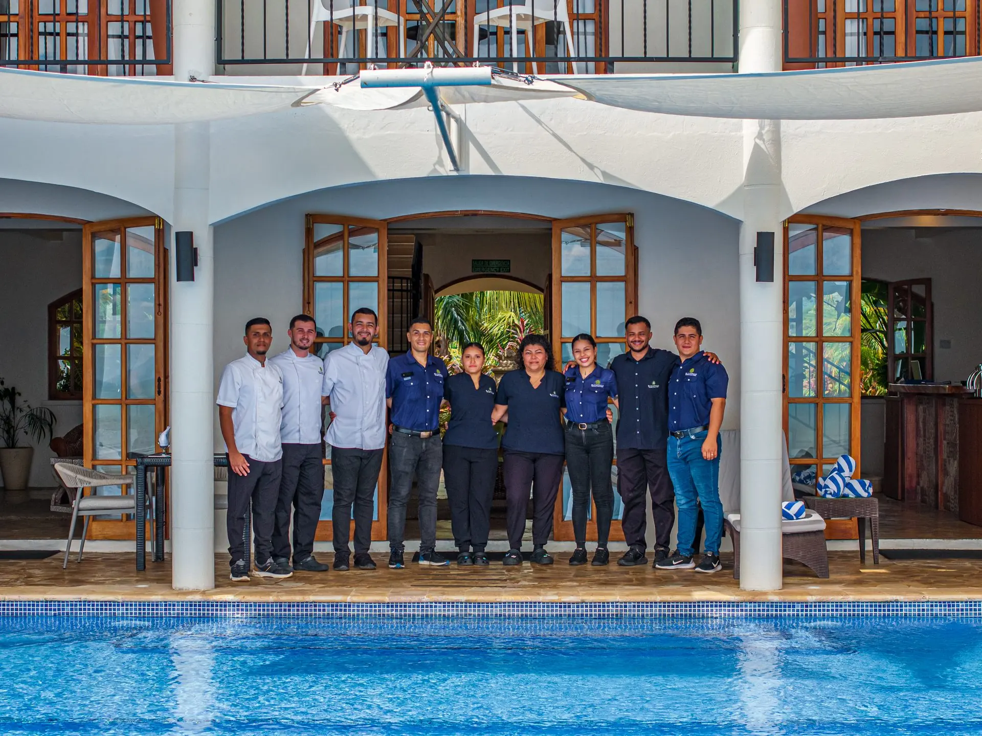 The El Castillo team gathered by the pool